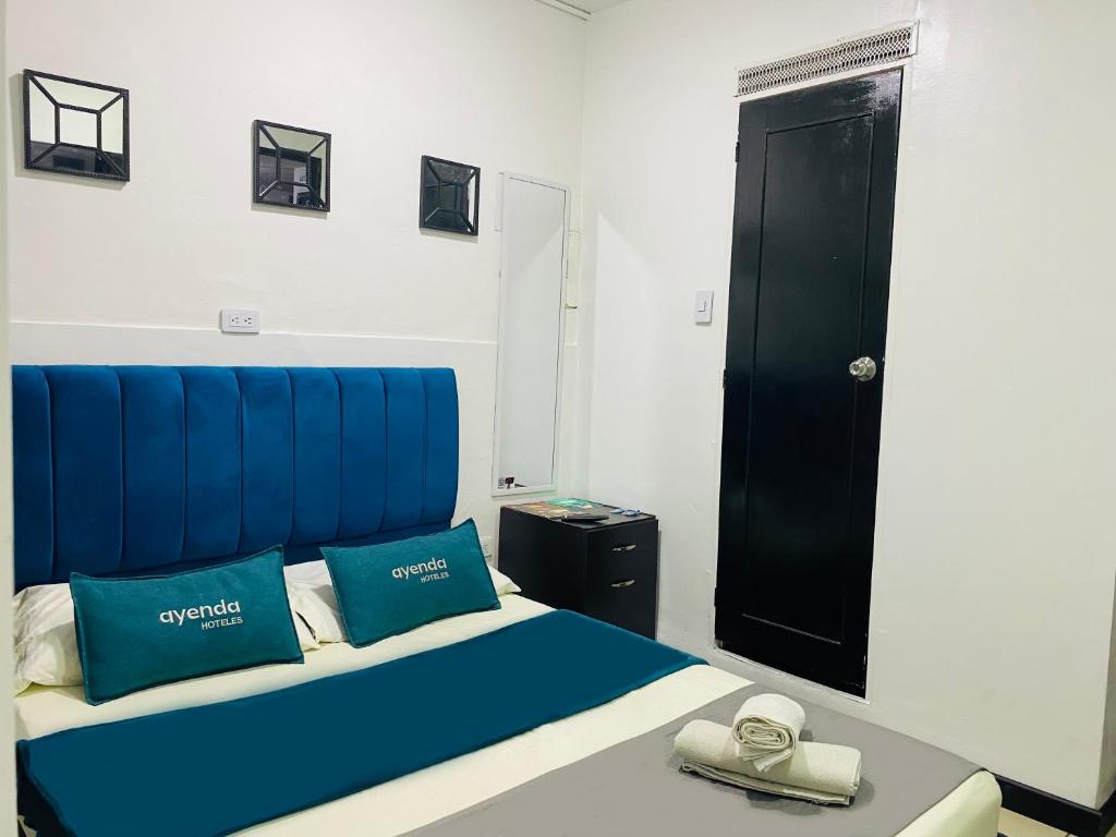 Postel nebo postele na pokoji v ubytování Hotel Bogota Home