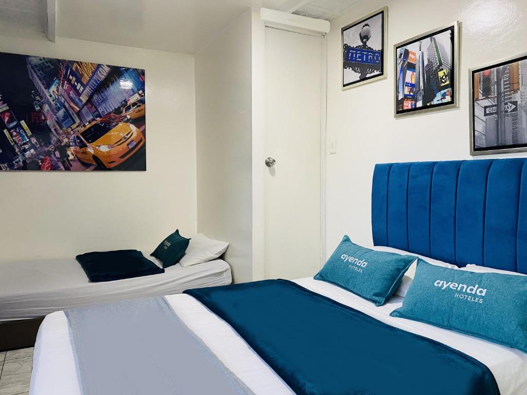 Postel nebo postele na pokoji v ubytování Hotel Bogota Home