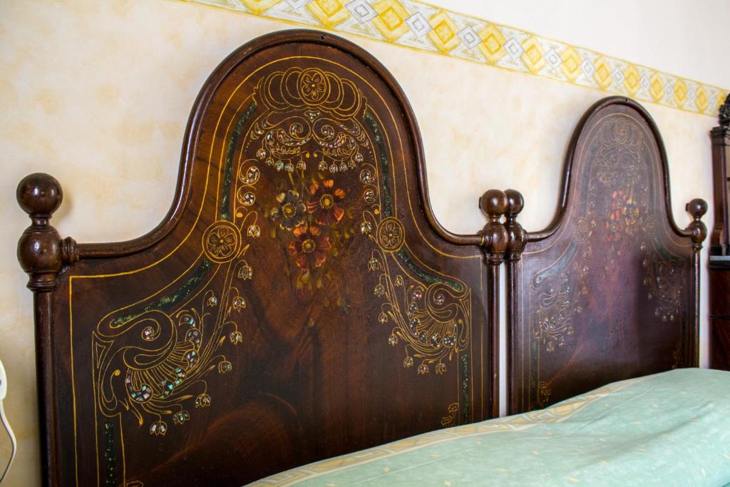 Postel nebo postele na pokoji v ubytování B&B Giardino Di Pietra