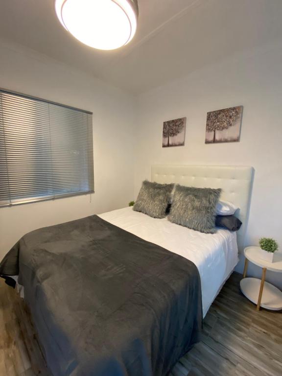 a bedroom with a large bed in a room at Little Miracle in Beaufort West