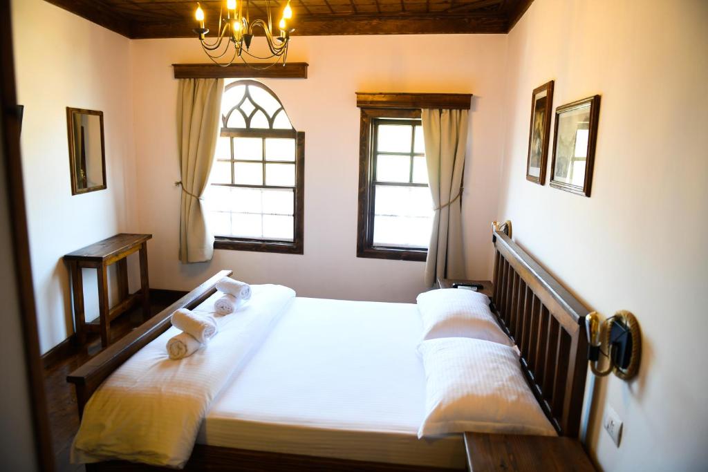 Llit o llits en una habitació de Anhel Hotel