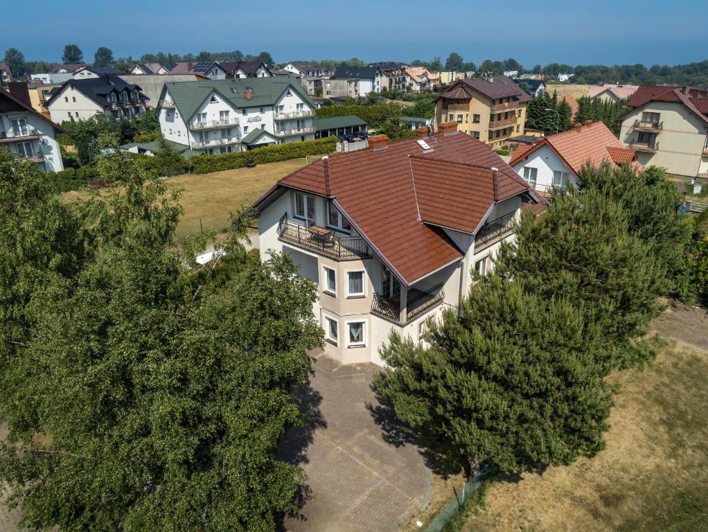 an overhead view of a house with a brown roof at Rubin-Chłapowo in Władysławowo