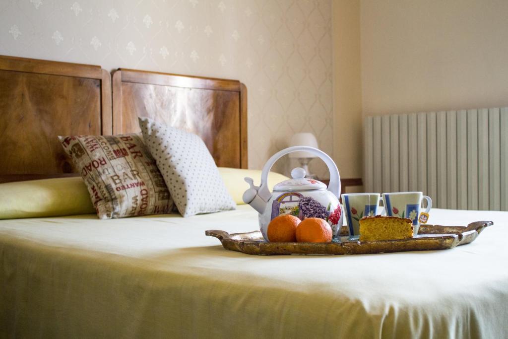 Postel nebo postele na pokoji v ubytování B&B Giardino Di Pietra