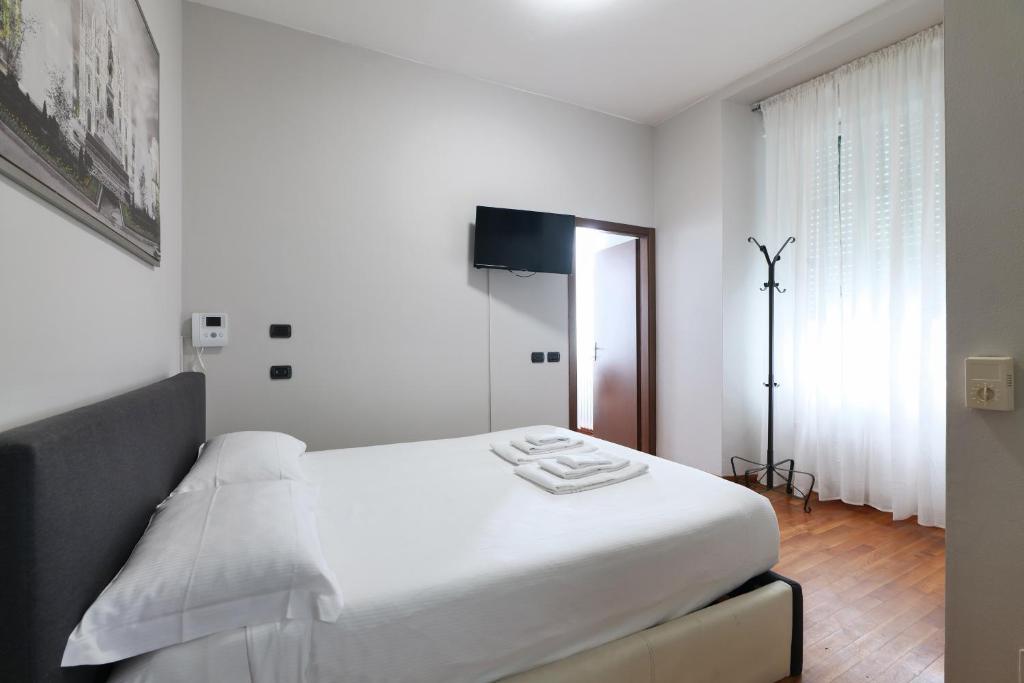Łóżko lub łóżka w pokoju w obiekcie PRESTIGE BOUTIQUE HOMES - Duomo 2