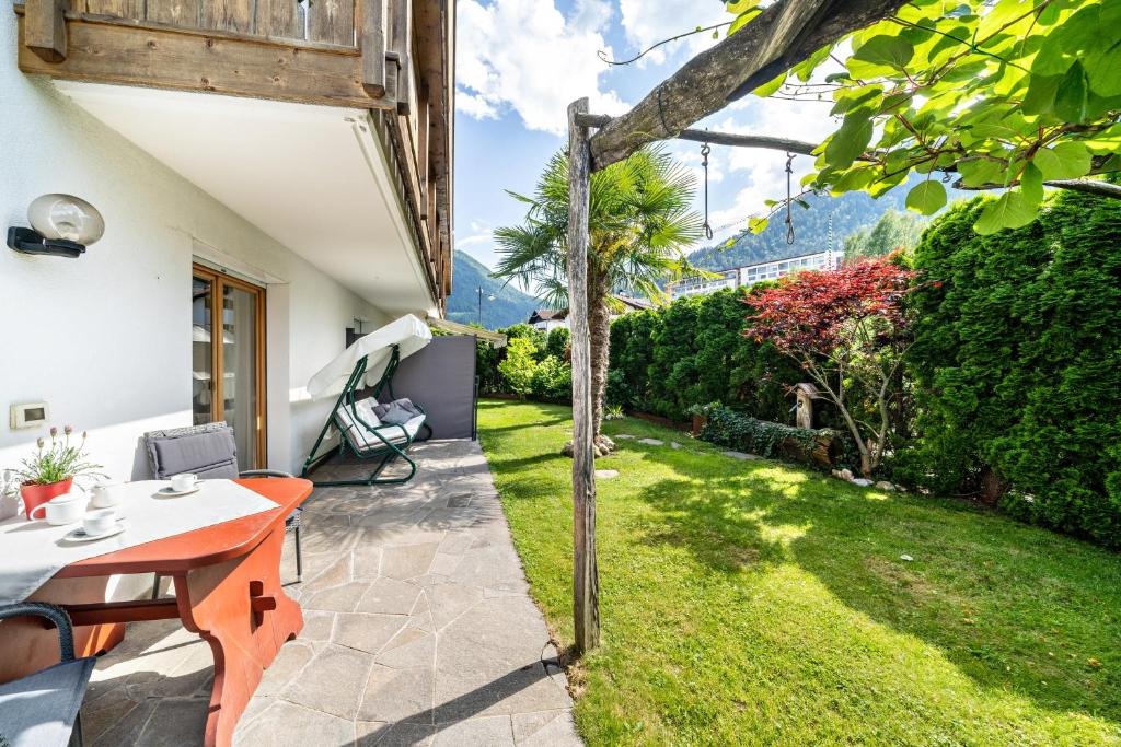 a garden view from the patio of a house at Ferienhof Turmwirt Gala in Lana