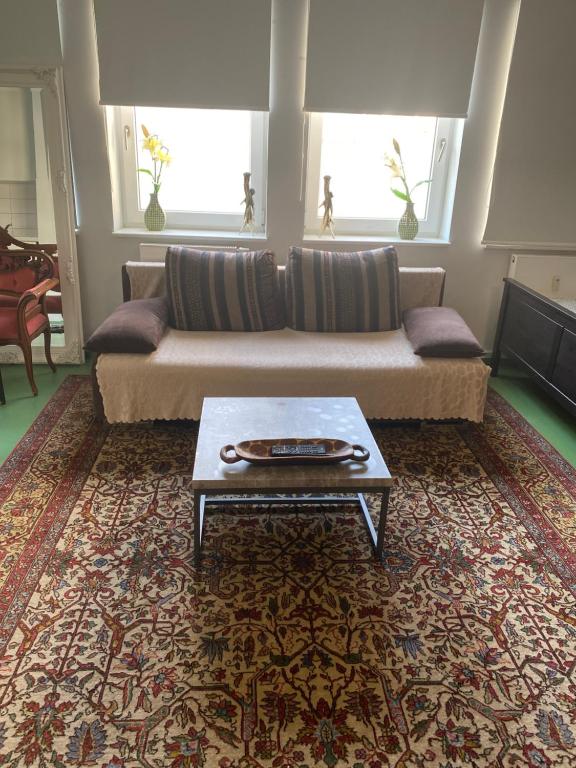 a living room with a couch and a coffee table at Wiesbaden Apartment in Wiesbaden