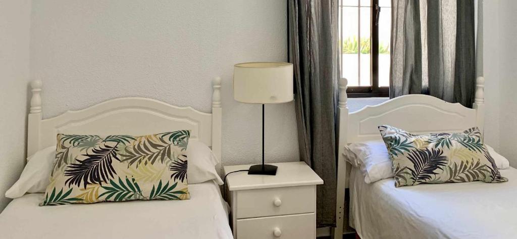 Posteľ alebo postele v izbe v ubytovaní Urb Las Cañas Apartamento F1