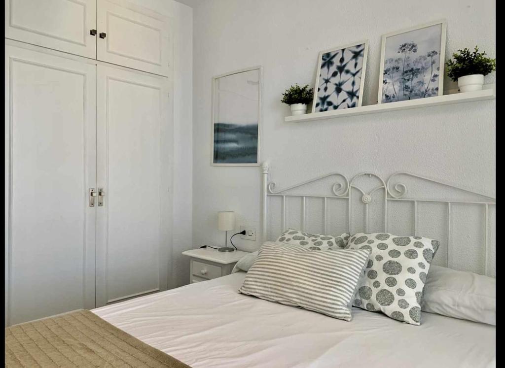 Posteľ alebo postele v izbe v ubytovaní Urb Las Cañas Apartamento F1