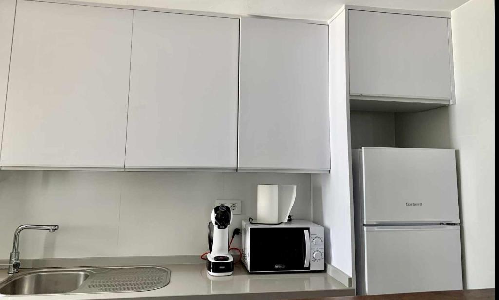 Kuchyňa alebo kuchynka v ubytovaní Urb Las Cañas Apartamento F1