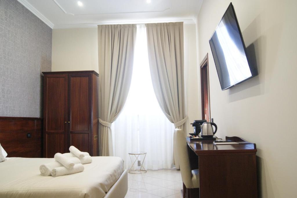 Postel nebo postele na pokoji v ubytování Monti 66 Hotel