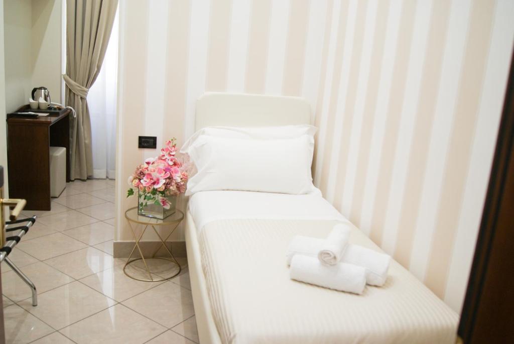 Postel nebo postele na pokoji v ubytování Monti 66 Hotel
