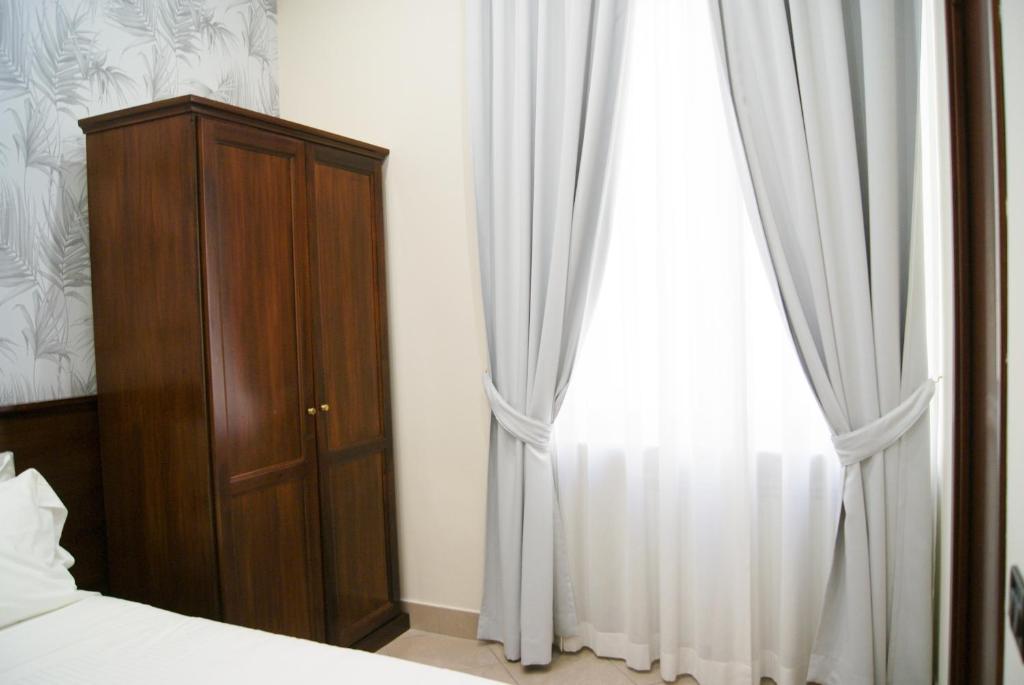 Postel nebo postele na pokoji v ubytování Monti 66 Hotel
