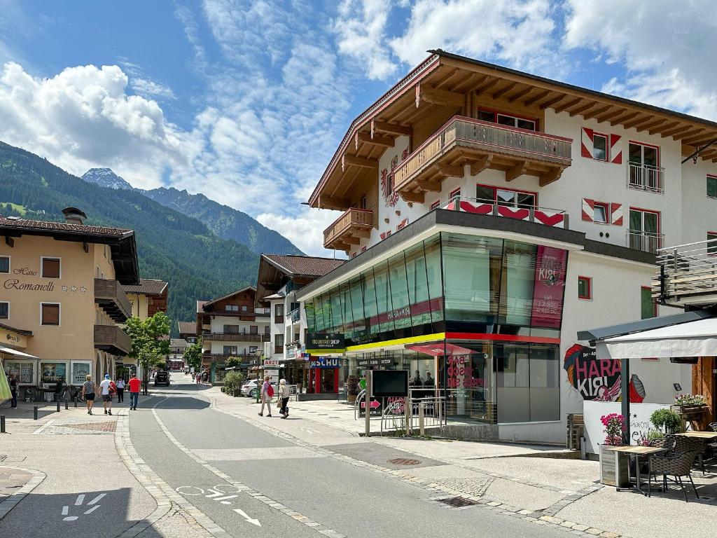 a building on the side of a street in a town at Harakiri lodgings und ApresSki in Mayrhofen