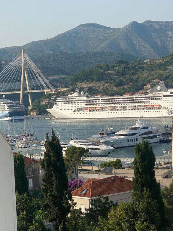 a cruise ship is docked in a harbor at King's Landing Esma' house in Dubrovnik