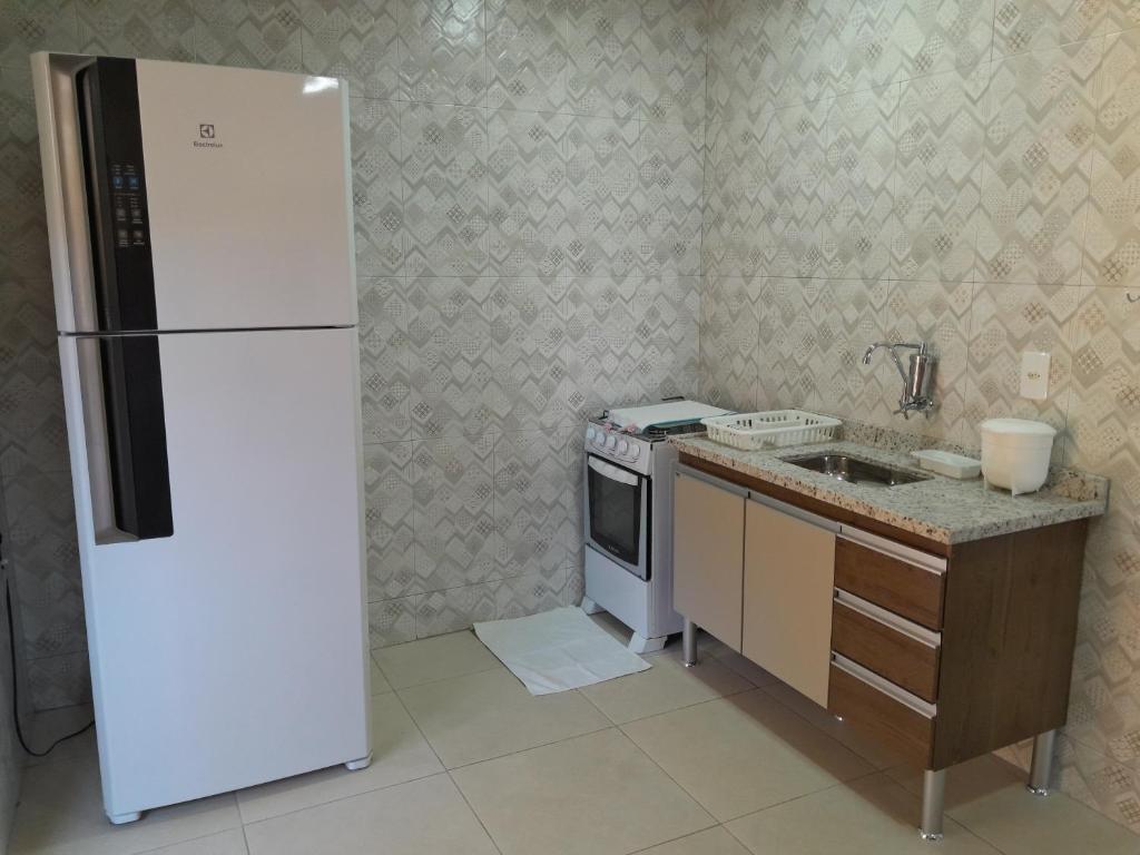 Kuchyň nebo kuchyňský kout v ubytování Casa de Temporada Ceu e Mar