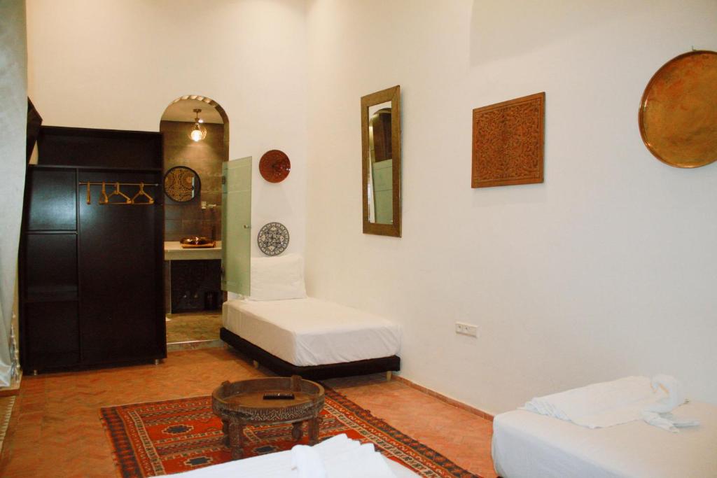 Letto o letti in una camera di Riad Zyna