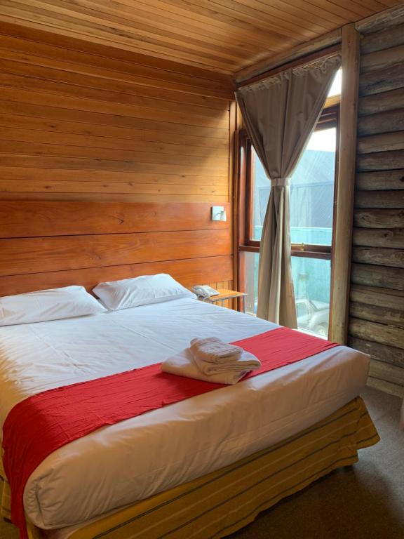 Postel nebo postele na pokoji v ubytování Hosteria Posta de los Colonos