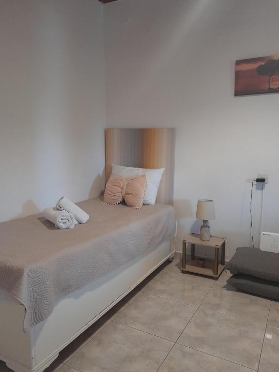 A bed or beds in a room at Gorjelina `s House