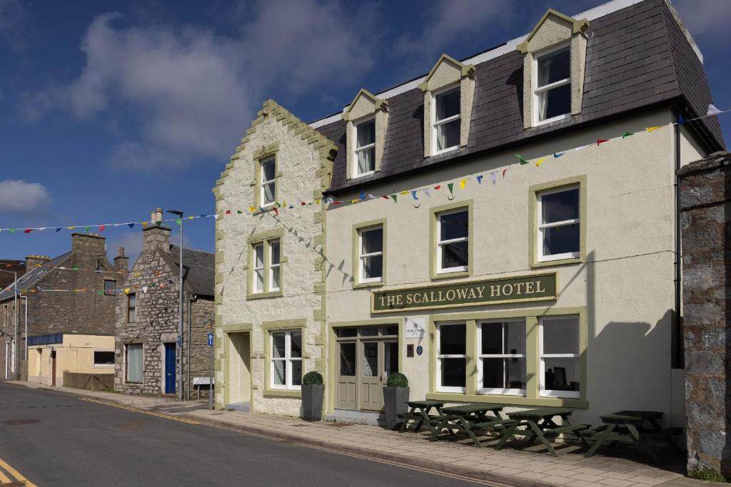 a building on the side of a street at Scalloway Hotel in Scalloway