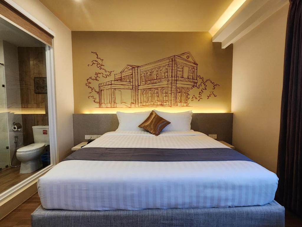 Postel nebo postele na pokoji v ubytování The Rangoon Hotel