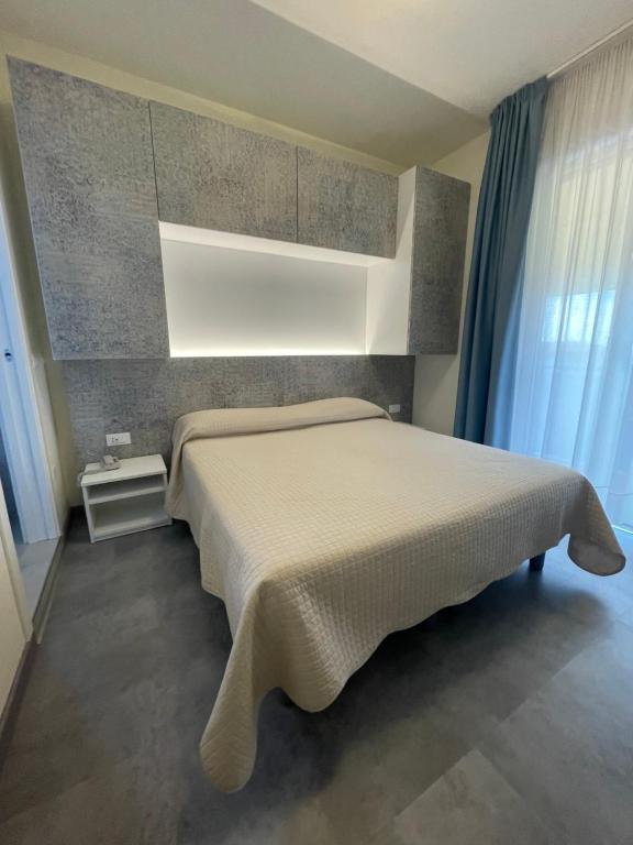 Postel nebo postele na pokoji v ubytování Hotel Catto Suisse