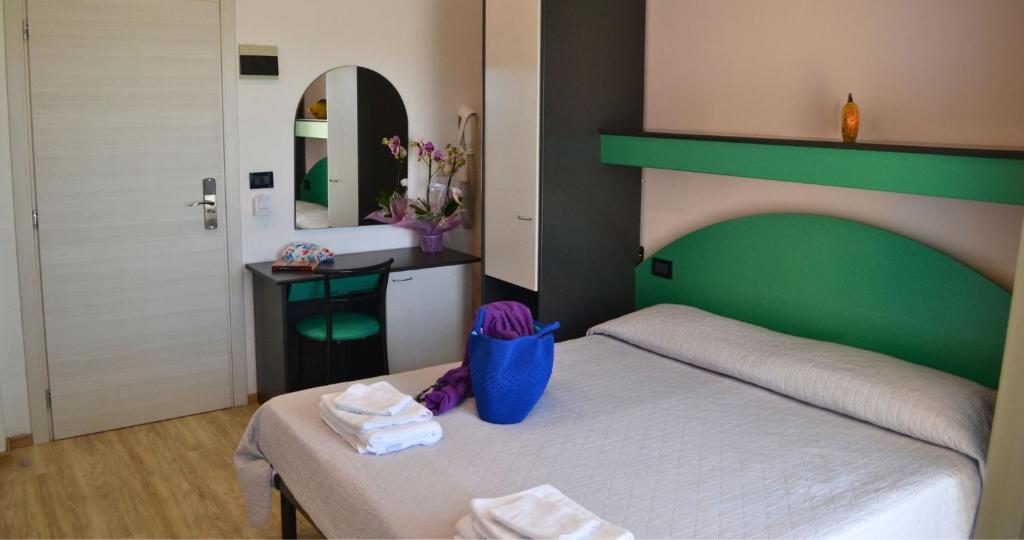 Postel nebo postele na pokoji v ubytování Hotel Tre Stelle