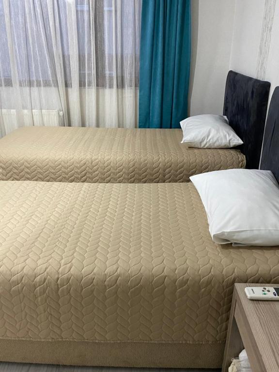 Postel nebo postele na pokoji v ubytování Elite Holiday Hotel