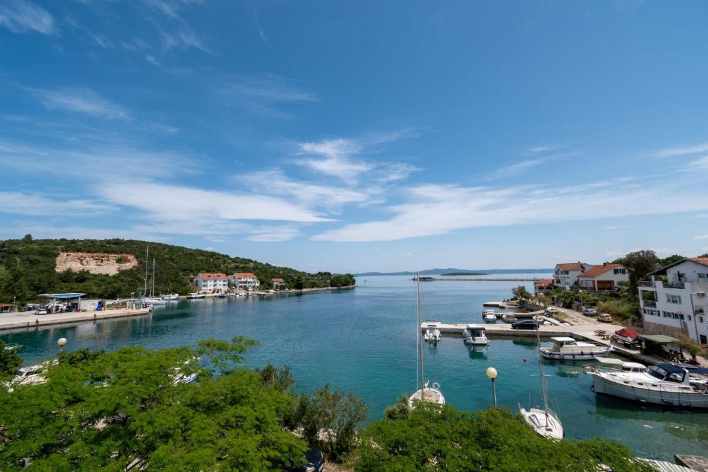 a view of a harbor with boats in the water at Kuća Zora in Zaglav