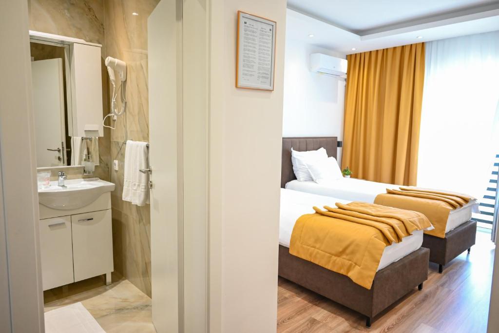 Letto o letti in una camera di Hotel Premium