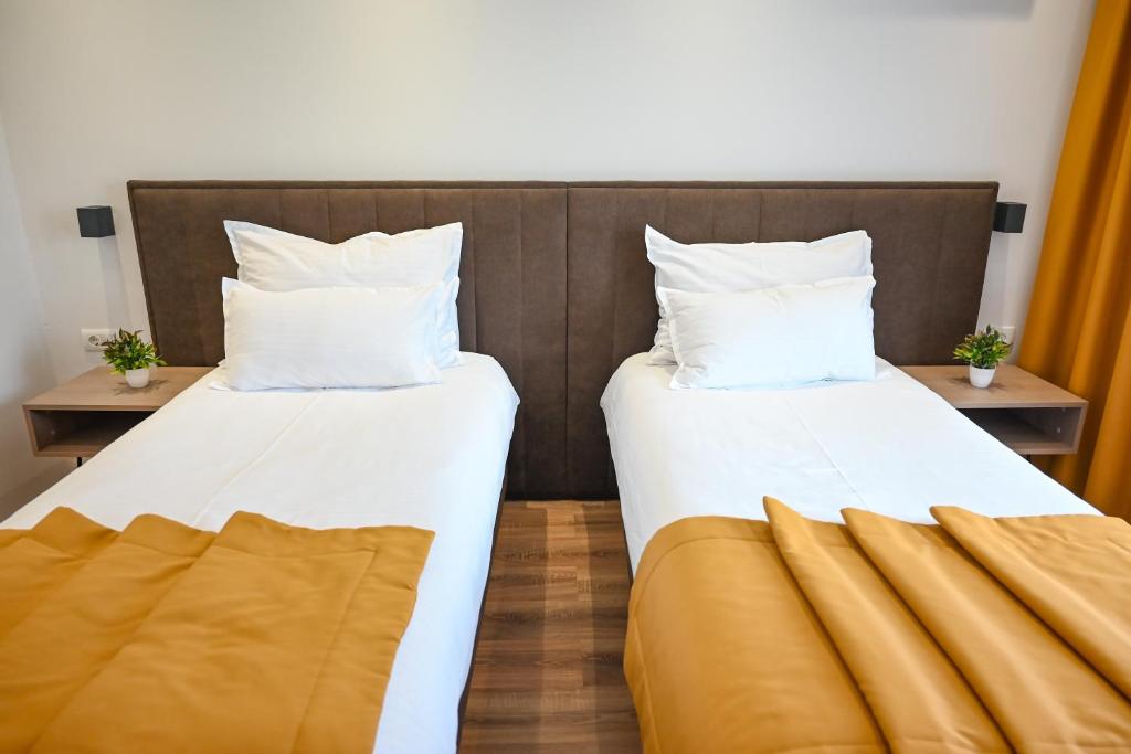Letto o letti in una camera di Hotel Premium