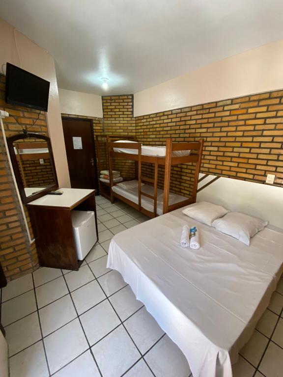 Cama ou camas em um quarto em Hotel D'Luz