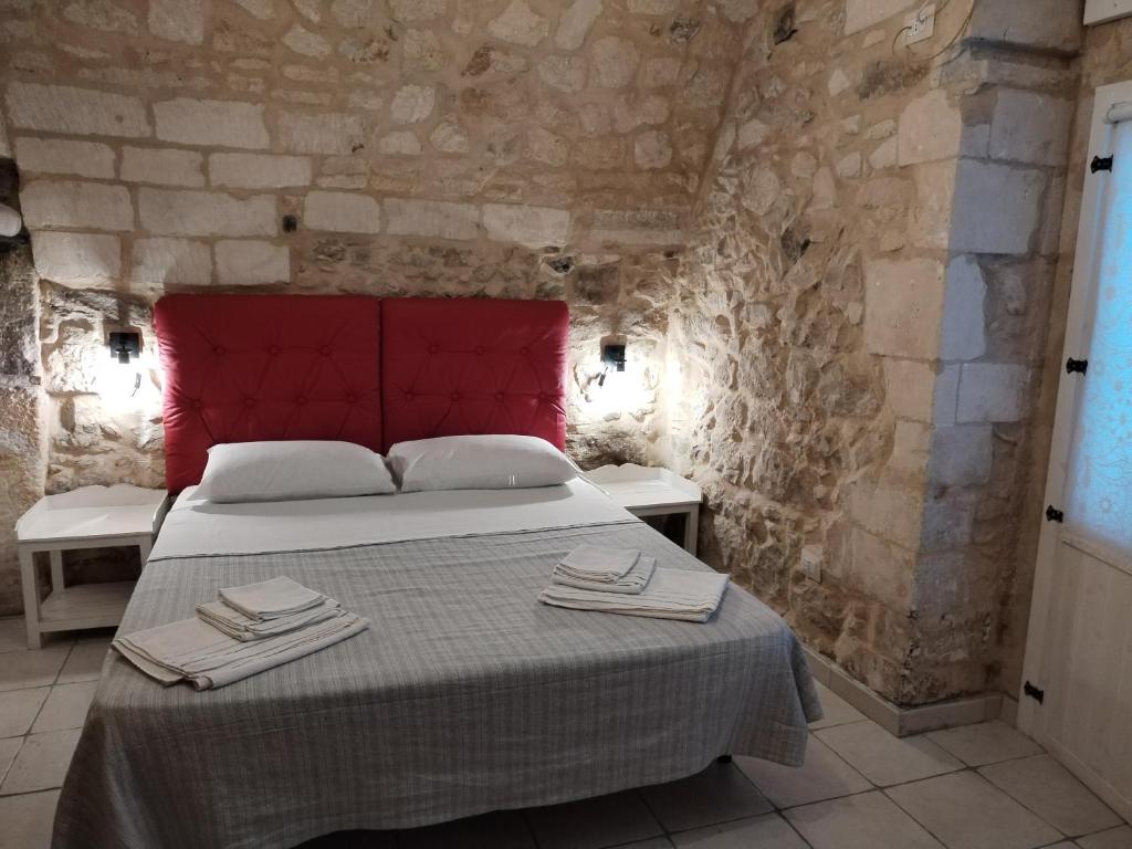 Tempat tidur dalam kamar di La carraia