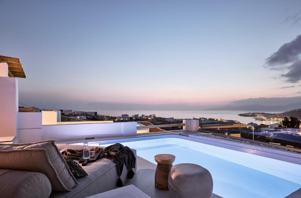 a large swimming pool on the roof of a house at Sharm Hotel Mykonos in Mikonos