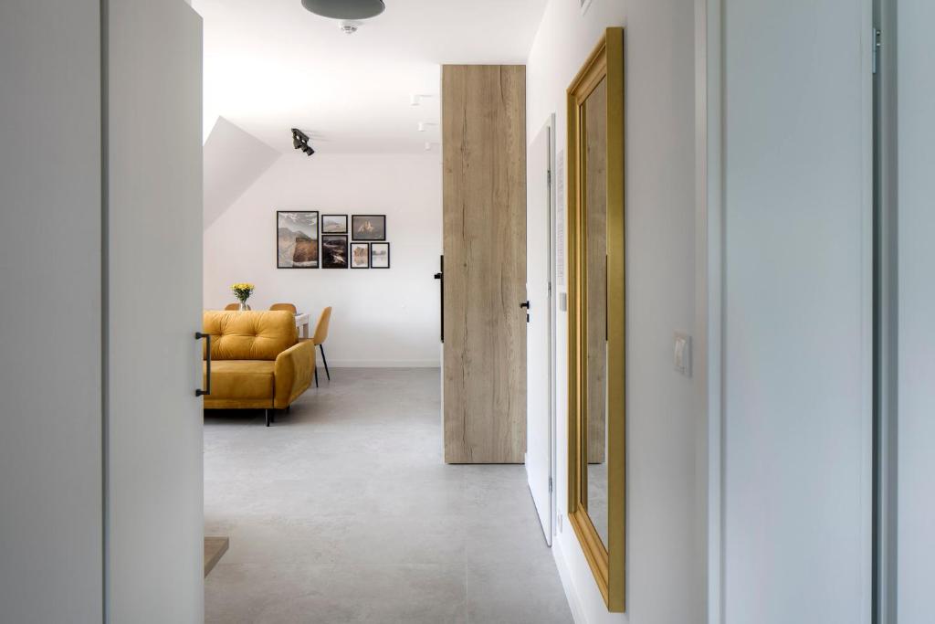 Postel nebo postele na pokoji v ubytování Apartamenty Zielona Lipka