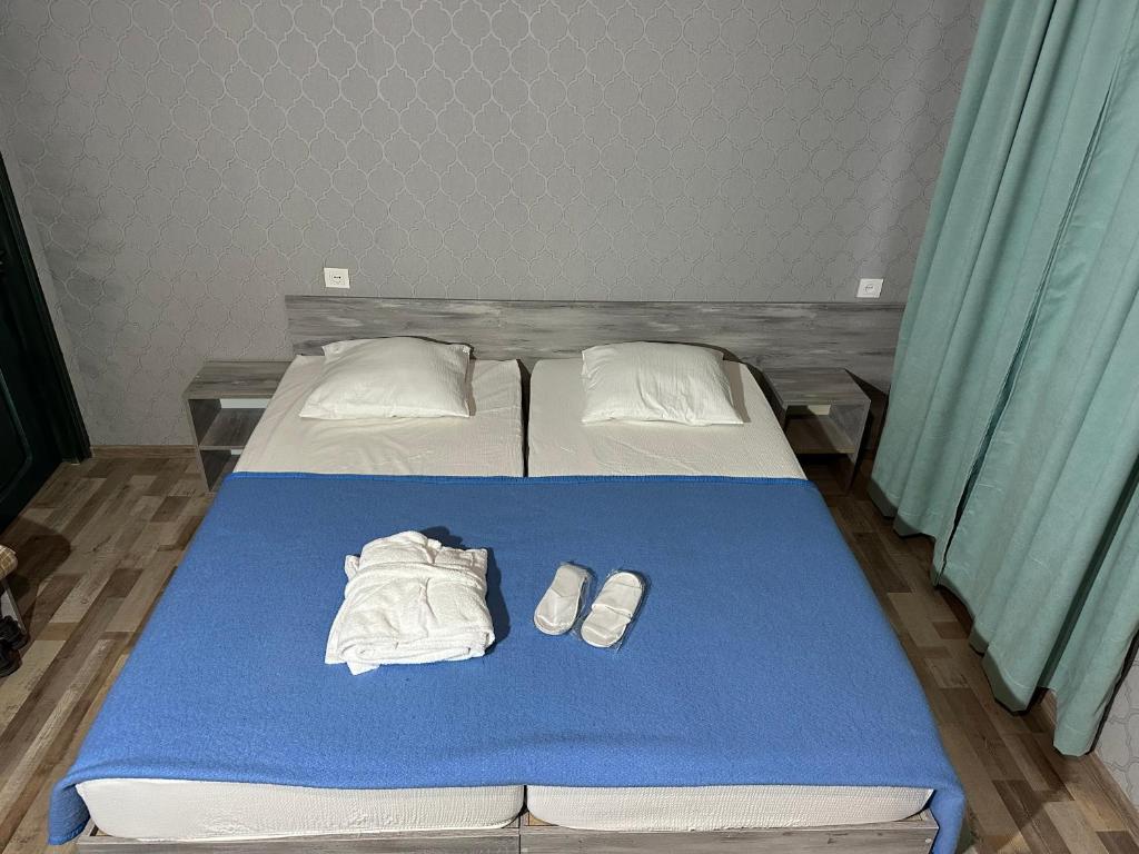 Postel nebo postele na pokoji v ubytování Nid Hotel