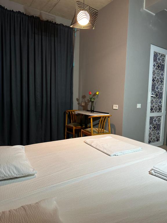 Postel nebo postele na pokoji v ubytování Nid Hotel