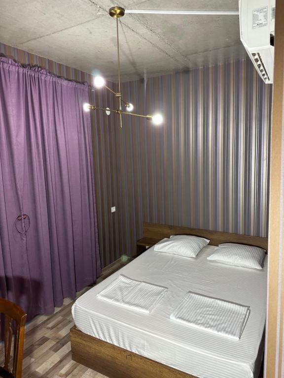 Postel nebo postele na pokoji v ubytování Nid Hotel