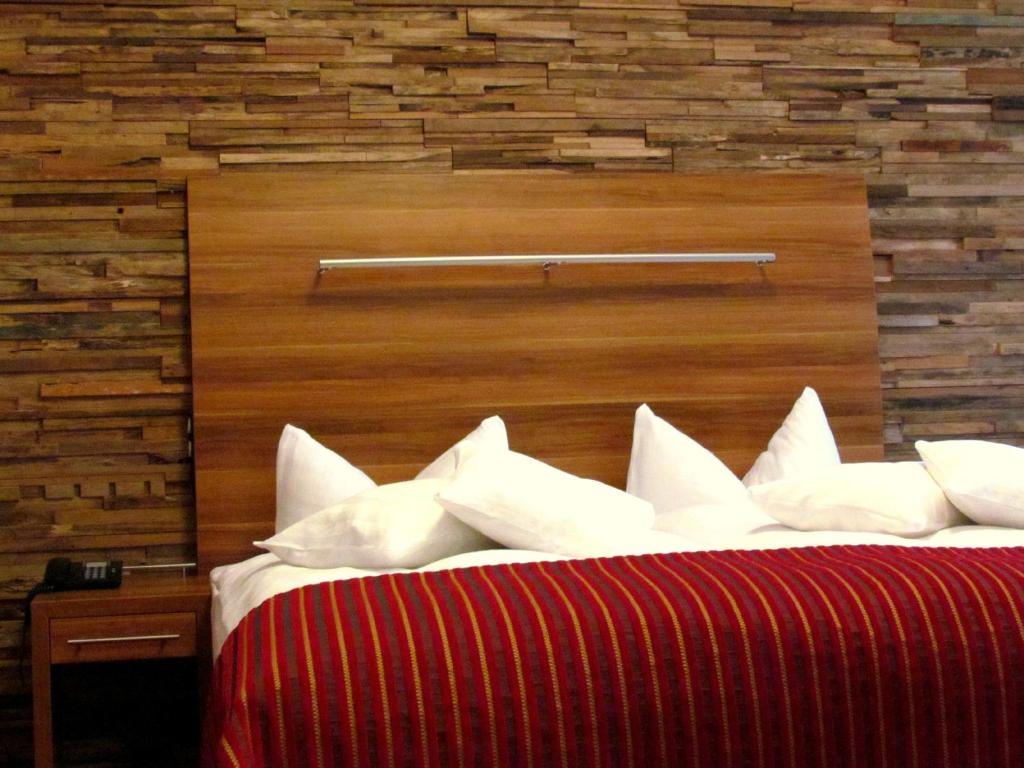 Postel nebo postele na pokoji v ubytování Hotel Almrausch