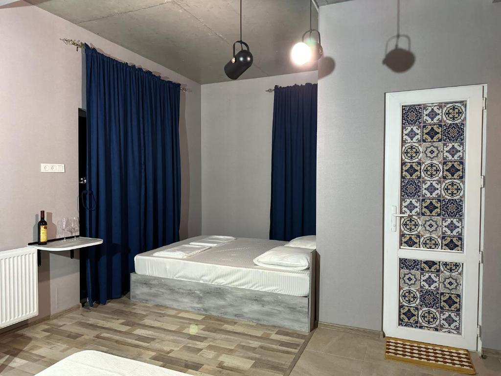 Postel nebo postele na pokoji v ubytování Nid Hotel