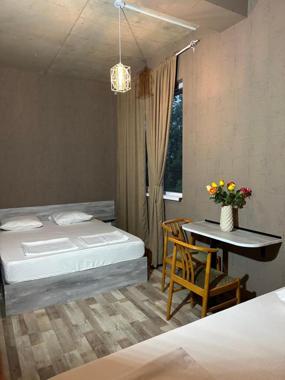 Postel nebo postele na pokoji v ubytování Nid Hotel