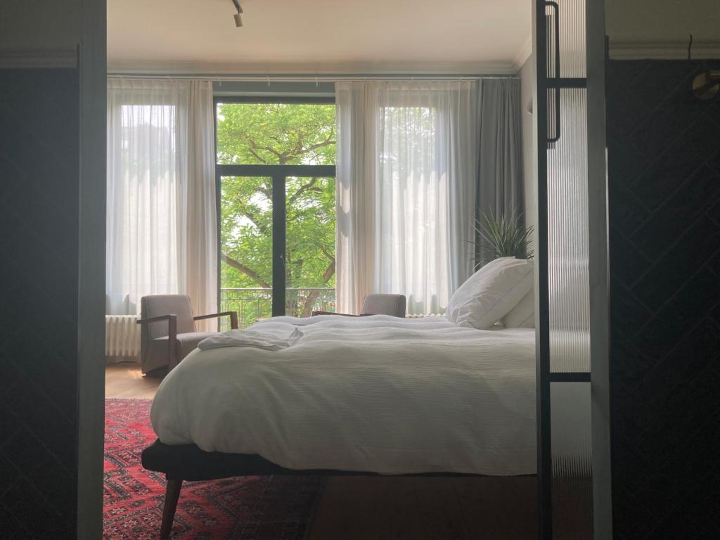Postel nebo postele na pokoji v ubytování Boutique Hotel Marie Marie