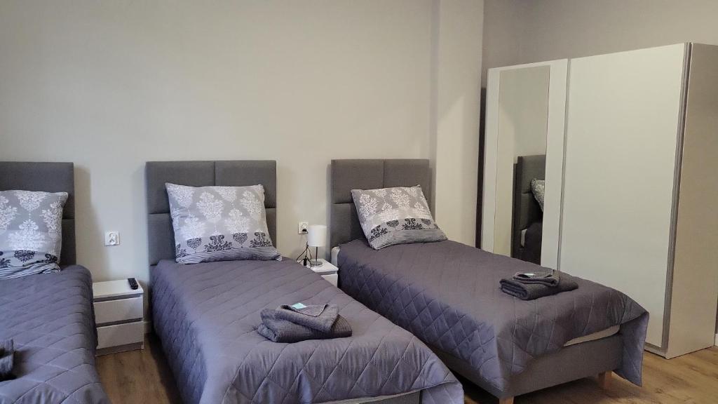 Postel nebo postele na pokoji v ubytování Central Platinum Apartments 2
