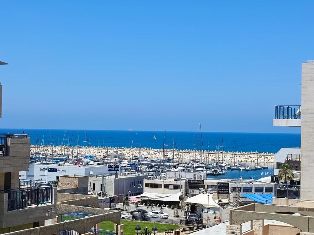 a marina with a bunch of boats in the water at By the Sea in Ashkelon