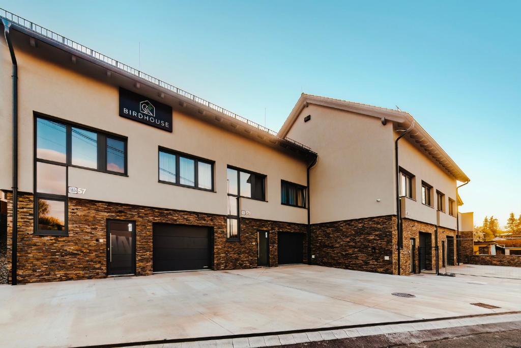 an empty parking lot in front of a building at BIRD HOUSE in Prešov