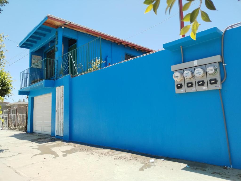 a blue building with two toilets on the side of it at Monchita's Ensenada Baja, apartments for rent. in Ensenada
