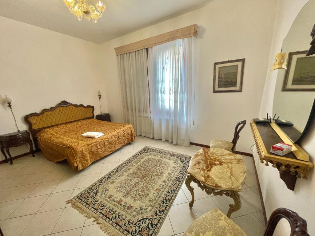Posteľ alebo postele v izbe v ubytovaní Queen House Venezia