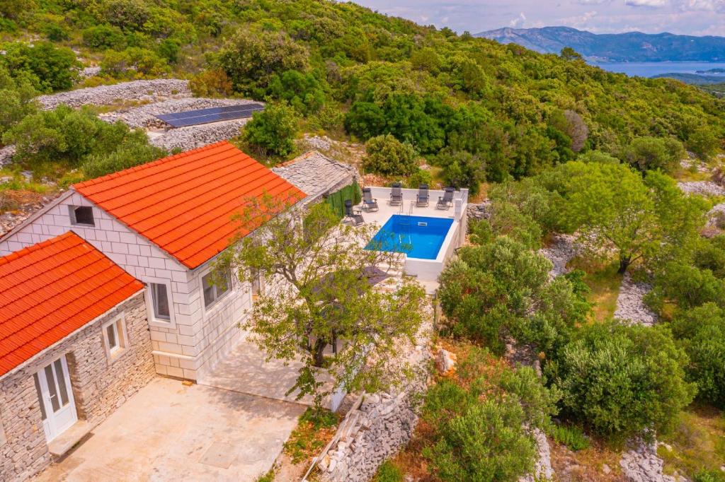 an overhead view of a house with an orange roof at Vila Podkalac in Žrnovo