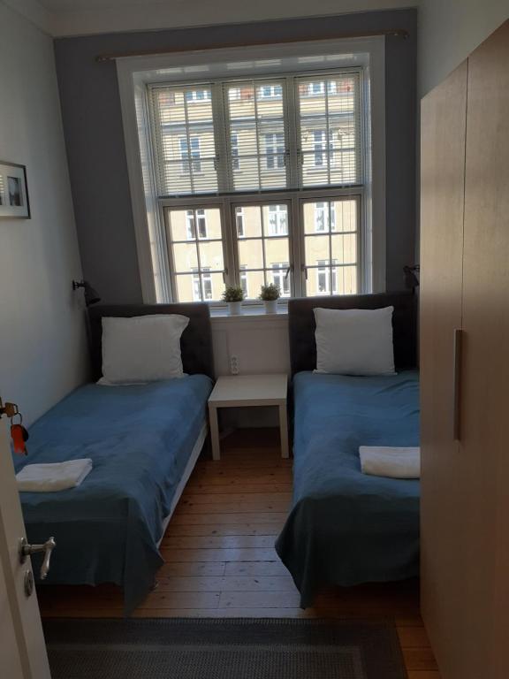 Postel nebo postele na pokoji v ubytování Rent a Room Copenhagen