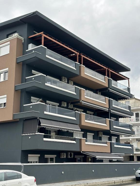 a building with balconies on the side of it at Blue Star #4 in Paralia Katerinis