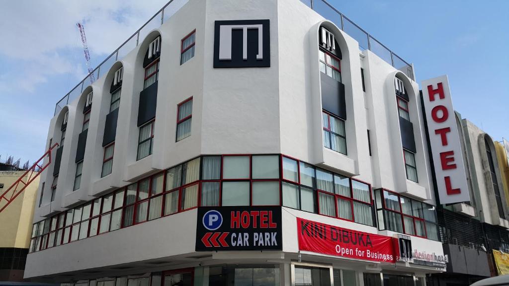 a large white building with a sign in front of it at M Design Hotel @ Shamelin Perkasa in Kuala Lumpur